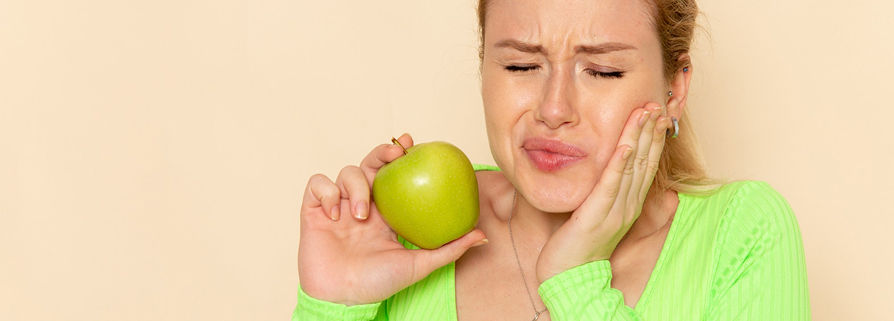 Dentist in Beaumaris examining patient for TMJ disorder and jaw dysfunction