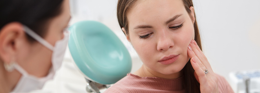 Worn teeth caused by bruxism leading to jaw pain and TMJ issues